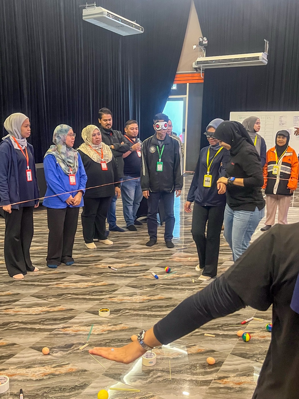 Colleagues taking part in a team icebreaker activity