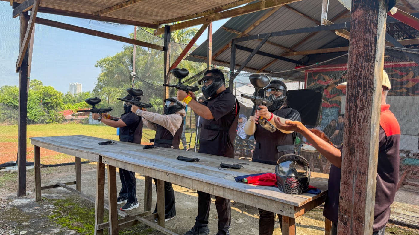 A team taking aim during a paintball activity