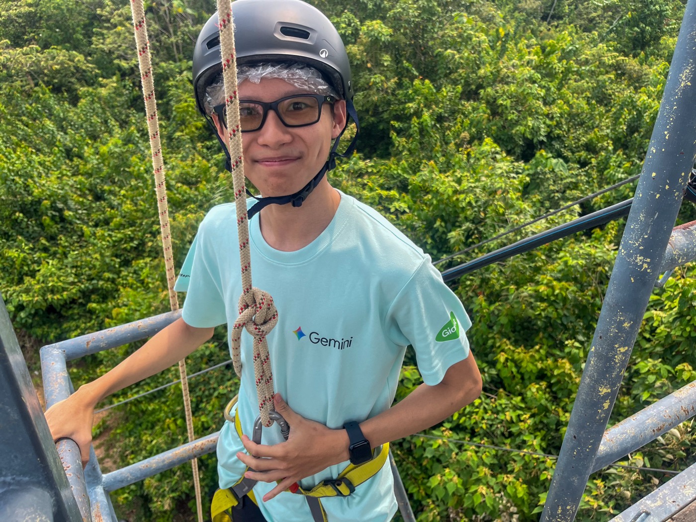 A participant harnessed up for a high ropes challenge